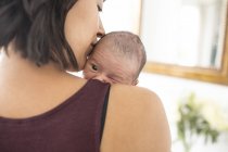 Mother holding newborn baby son — Stock Photo