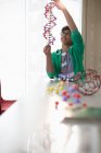 Boy student examining DNA model in laboratory classroom — Stock Photo