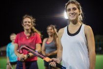 Portrait smiling, confident young female field hockey players — Stock Photo