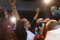 Enthusiastic woman cheering in audience — Stock Photo