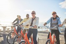 Active senior tourist friends bike riding — Stock Photo