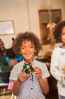 Portrait cute boy with decorated Halloween cupcake — Stock Photo