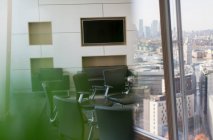 Chairs in circle in modern city conference room — Stock Photo