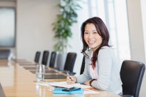 Portrait confident smiling businesswoman working in conference room — Stock Photo