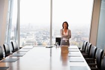Portrait confident businesswoman in conference room — Stock Photo
