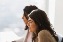 Profile businesswoman listening in meeting — Stock Photo