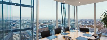 Modern conference room overlooking cityscape, London, UK — Stock Photo
