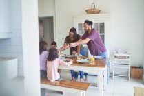 Family eating at dining table — Stock Photo
