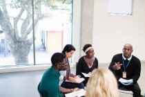 People talking in support group meeting circle — Stock Photo
