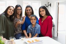 Portrait happy Indian women and girls in kitchen — Stock Photo