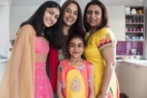 Portrait happy Indian mothers and daughters in saris — Stock Photo