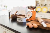Baking ingredients on kitchen counter — Stock Photo