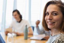 Portrait confident smiling businesswoman in meeting — Stock Photo