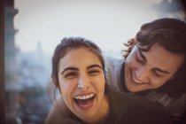 Close up portrait laughing young couple — Stock Photo