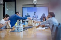 Business people with lunch in conference room meeting — Stock Photo