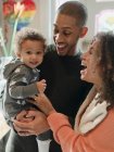 Portrait happy parents and baby daughter laughing — Stock Photo