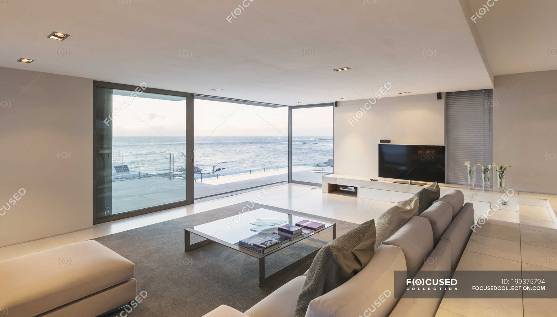 Modern Minimalist Luxury Living Room With Patio Doors Open To Ocean View Horizontal Building Stock Photo 199375794