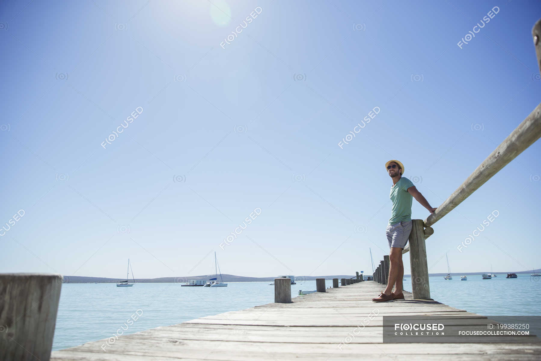 Man standing on wooden dock — nature, Weekend Activities - Stock Photo ...