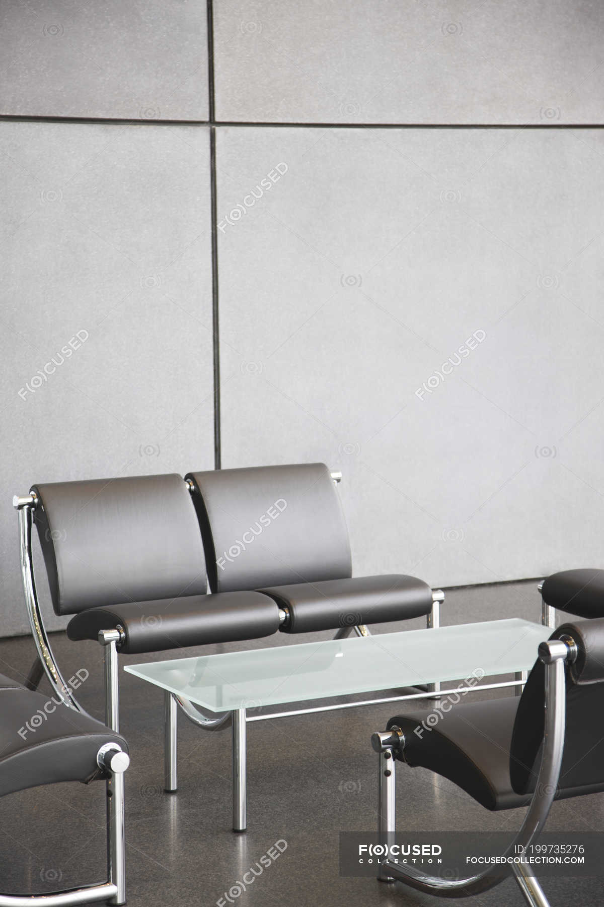 Chairs and table in office lobby area — day, horizontal Stock Photo 199735276