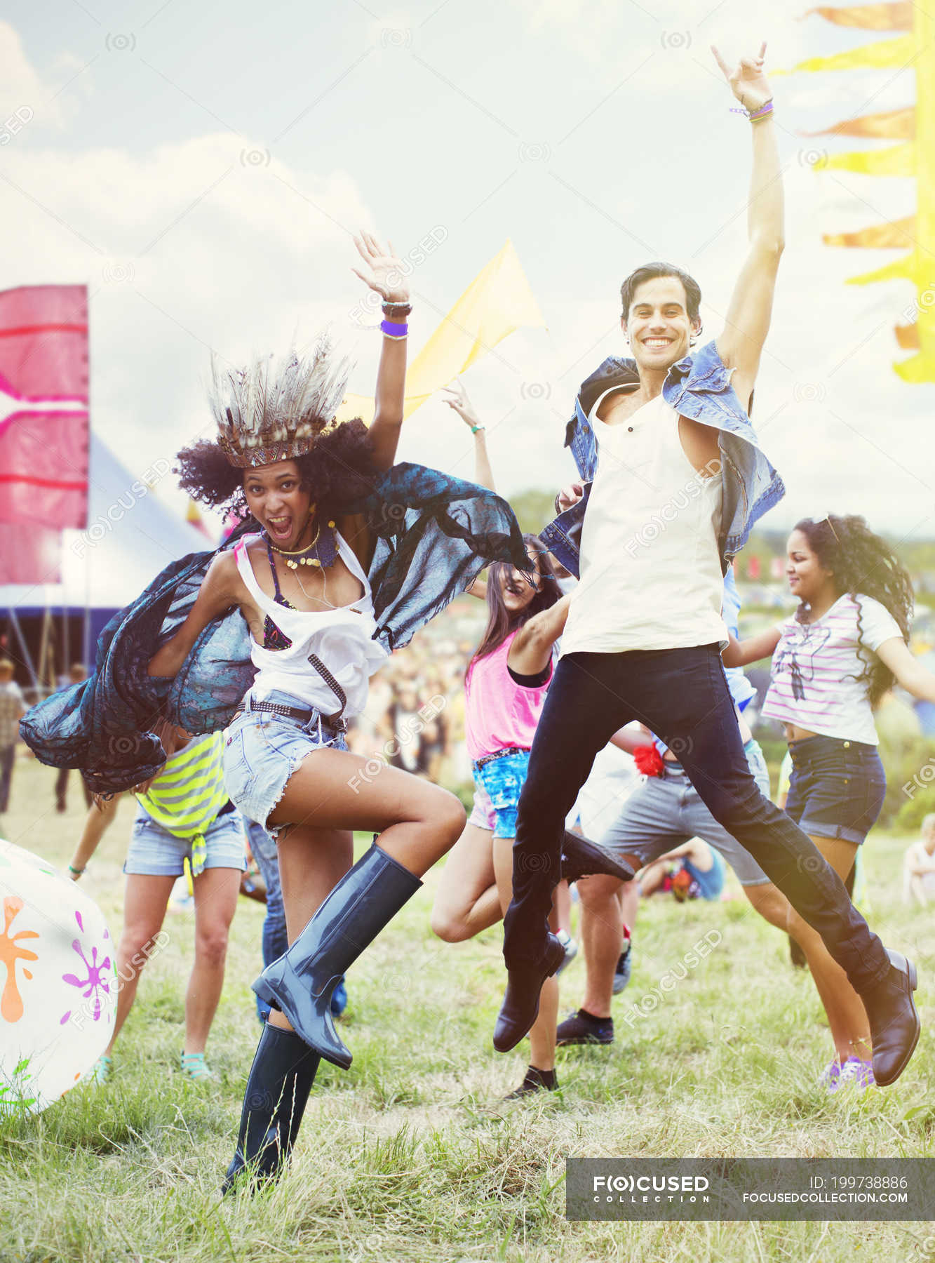 Enthusiastic friends dancing at music festival — Focus On Foreground,  smiling - Stock Photo | #199738886