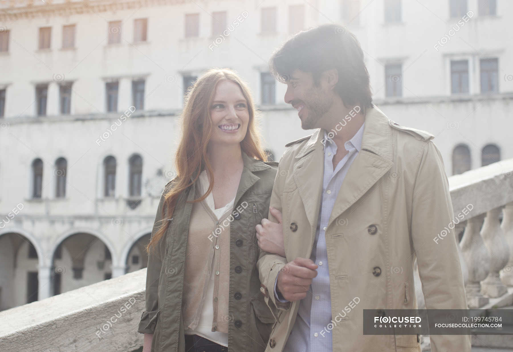 Smiling Couple Walking Arm In Arm In Venice Man Italy Stock Photo