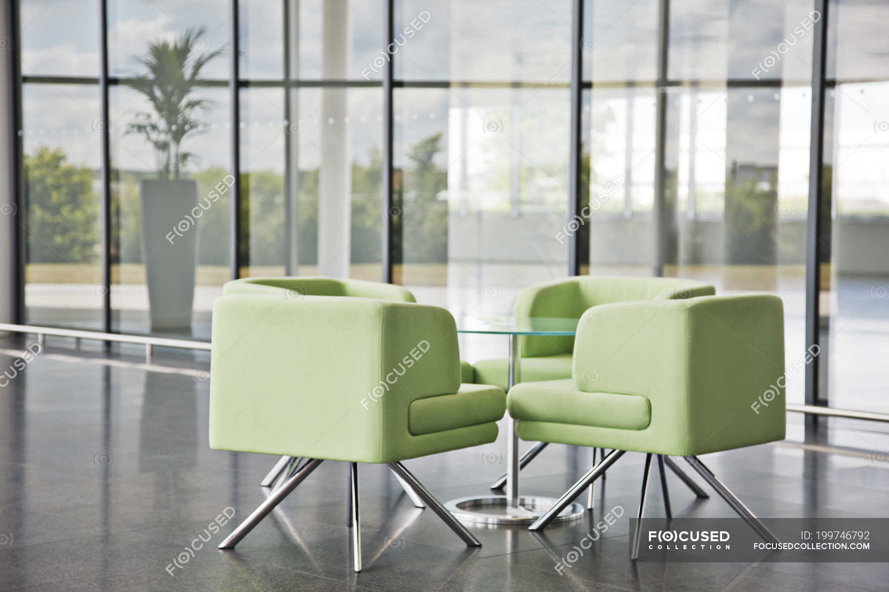 Chairs and table in office lobby area — commercial, background Stock Photo 199746792