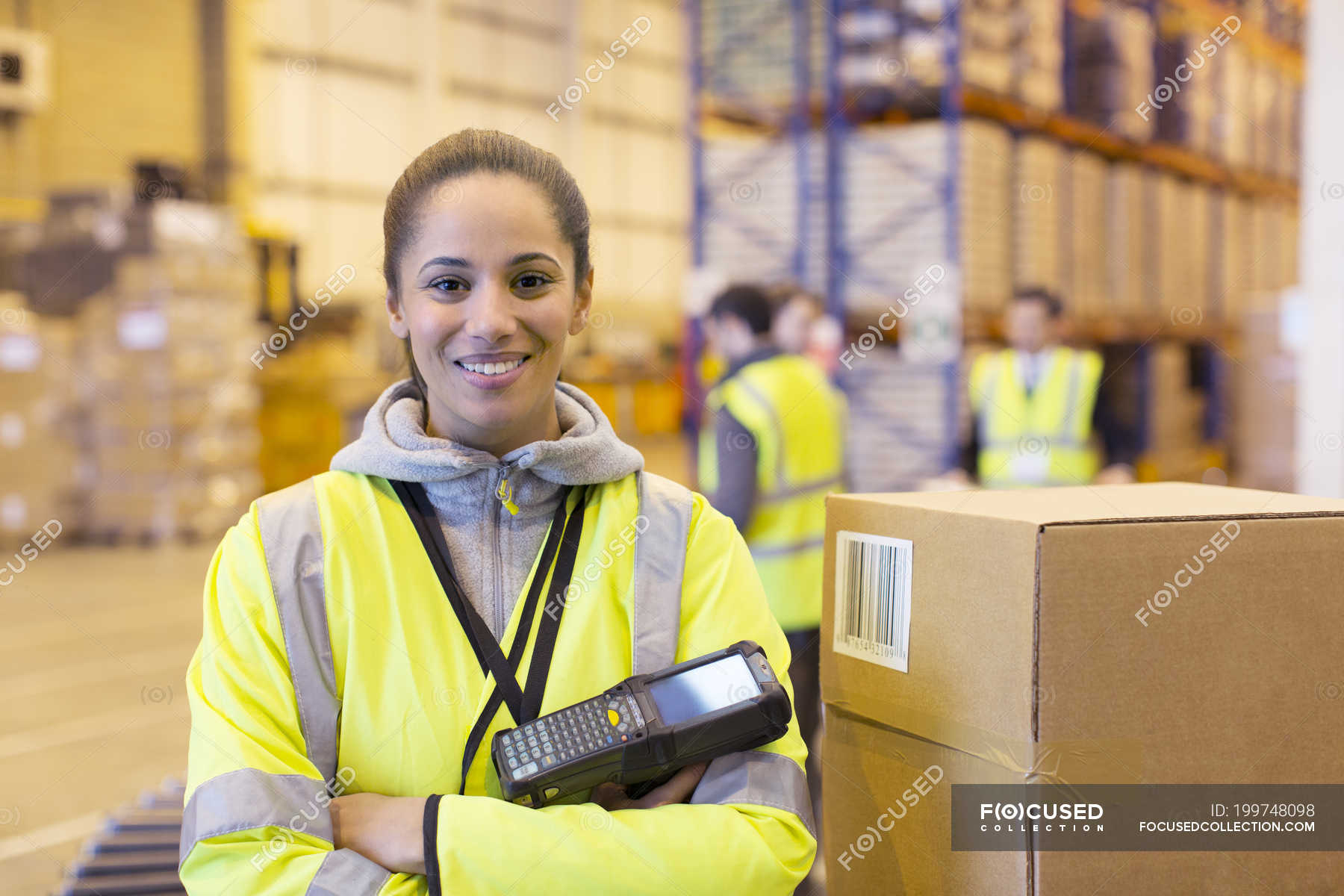 Worker holding scanner in warehouse — photography, woman - Stock Photo