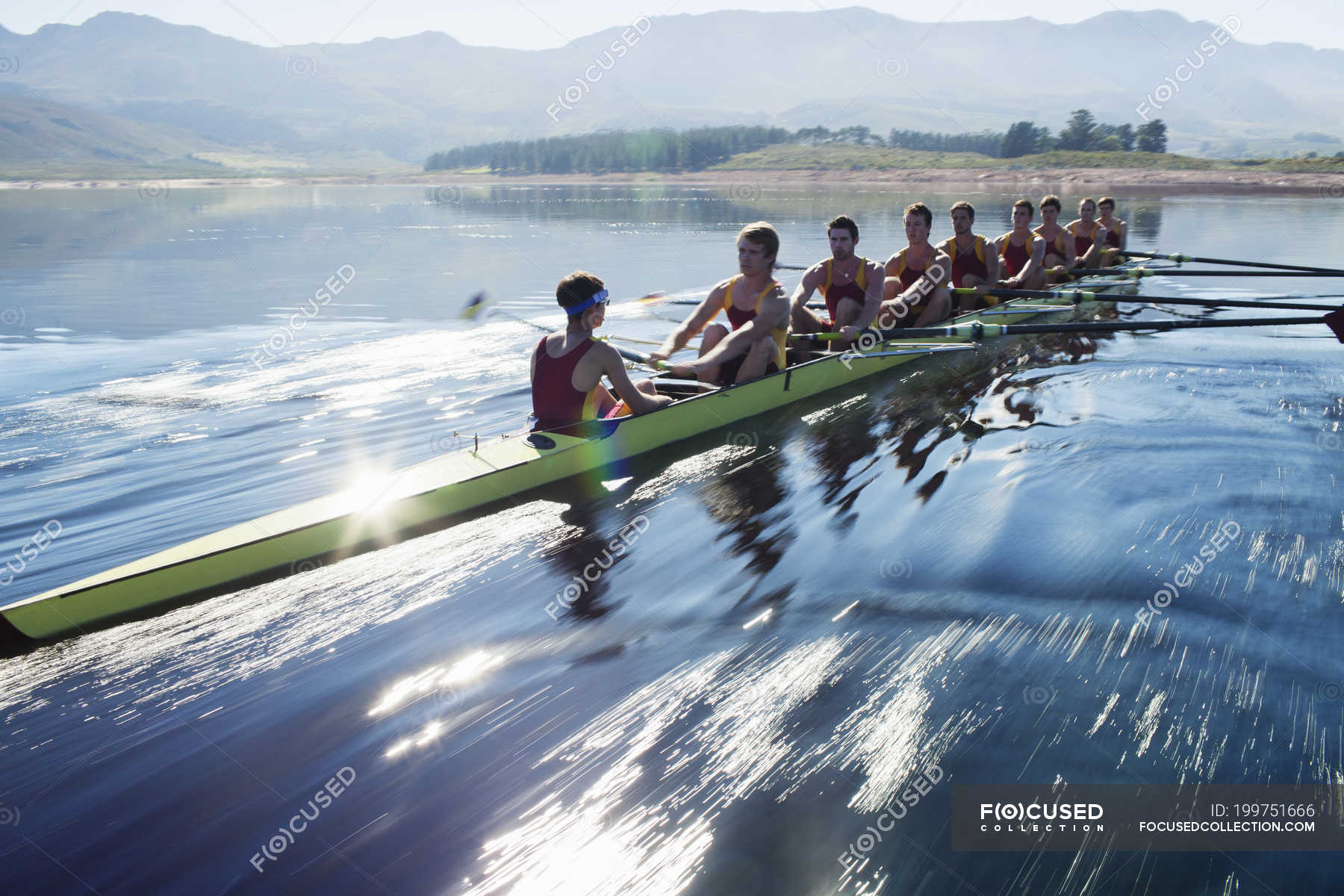 Rowing team rowing scull on lake — sunny, world sports event - Stock