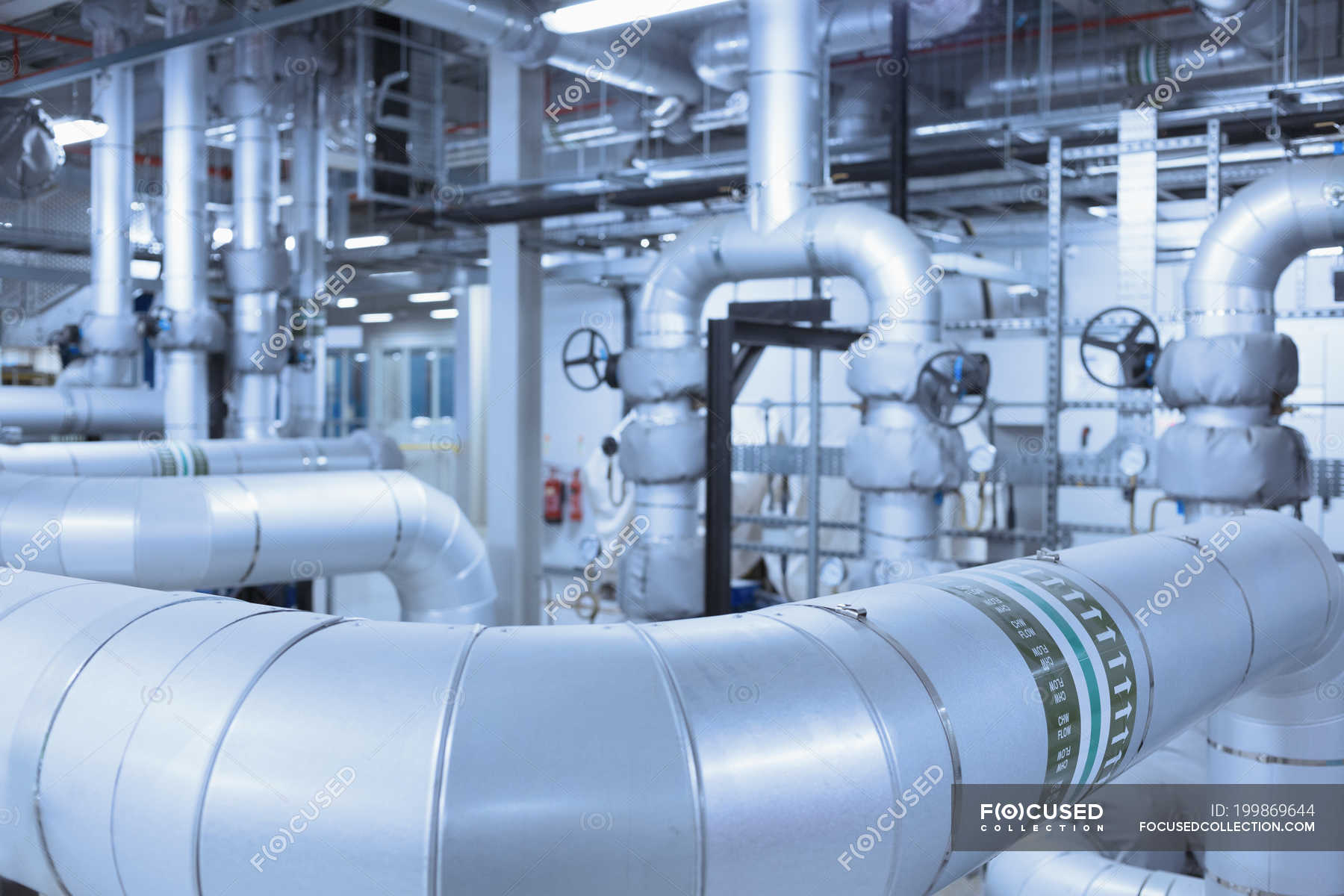 Network of pipes in factory indoors — commercial, engineering Stock