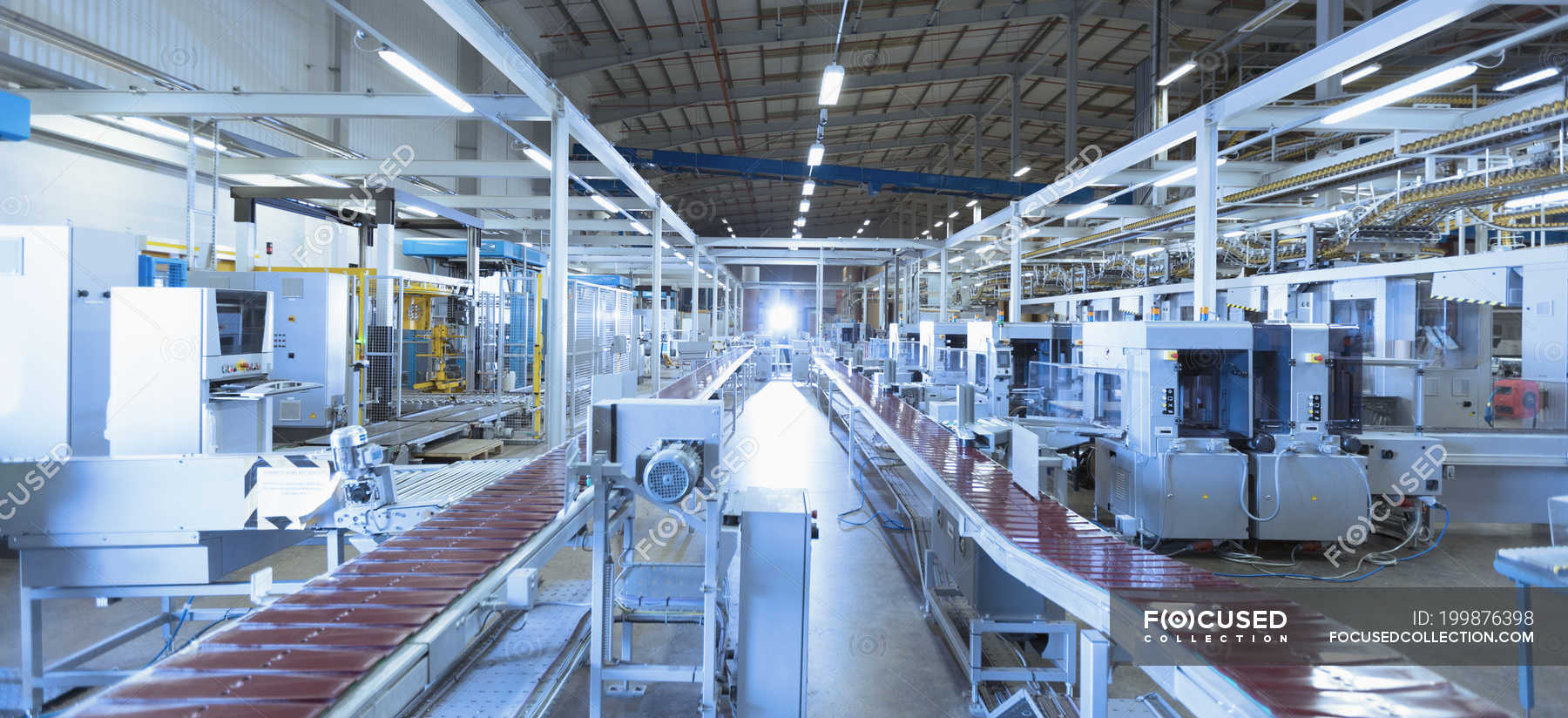 Conveyor belts and machinery in factory — commercial, backdrop Stock