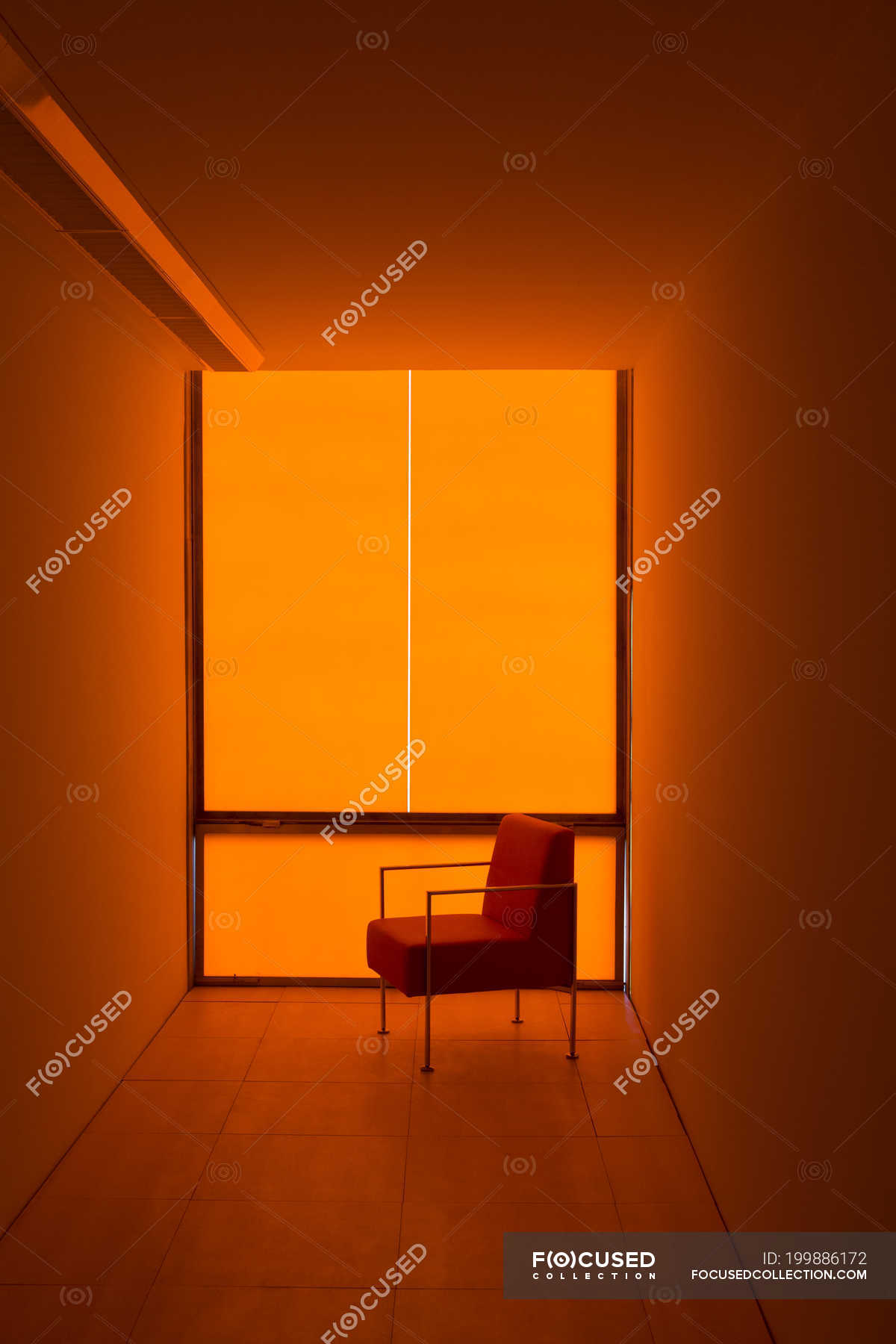 Chair at window in orange office — indoor, closed - Stock Photo ...