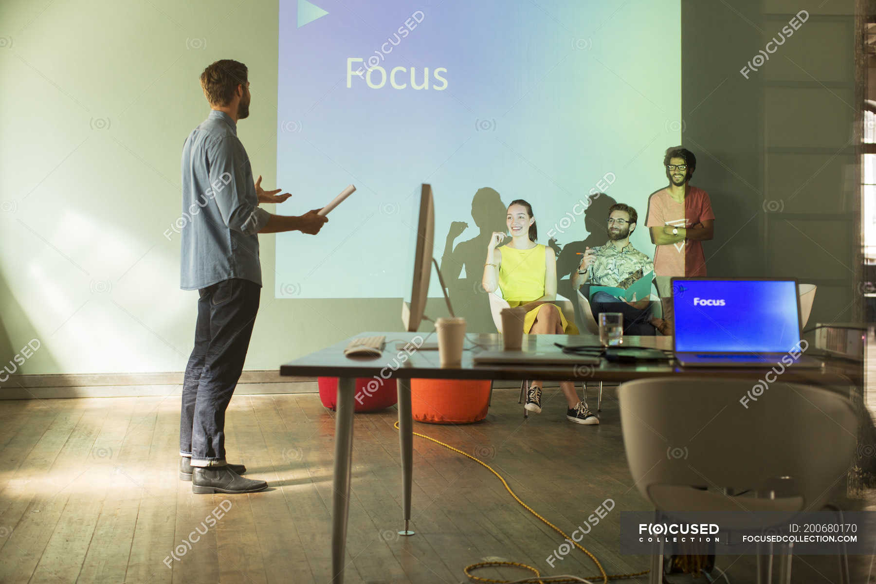 Business people preparing audio visual presentation on Focus