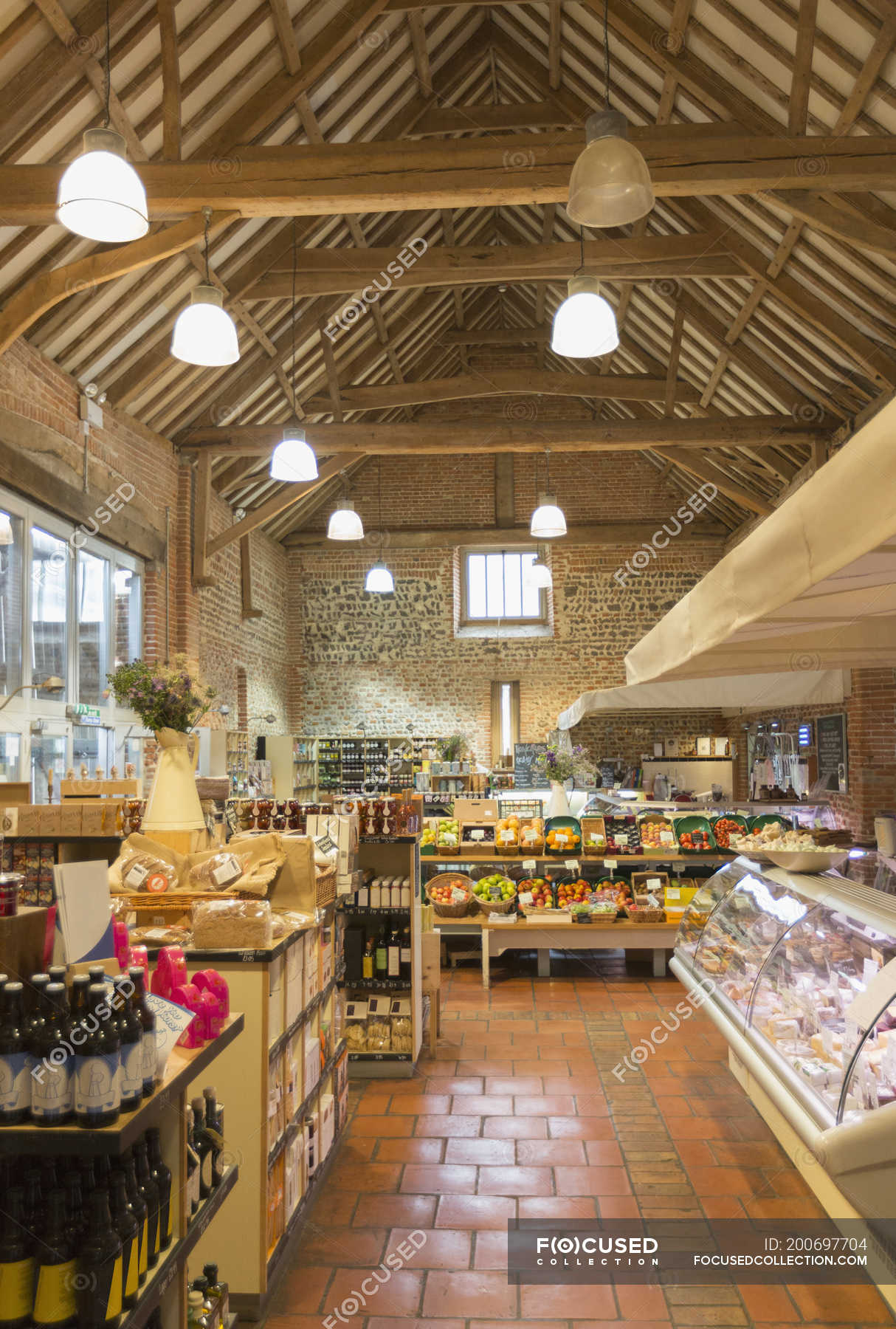 Market with vaulted wood beam ceiling — grocery store, indoors Stock