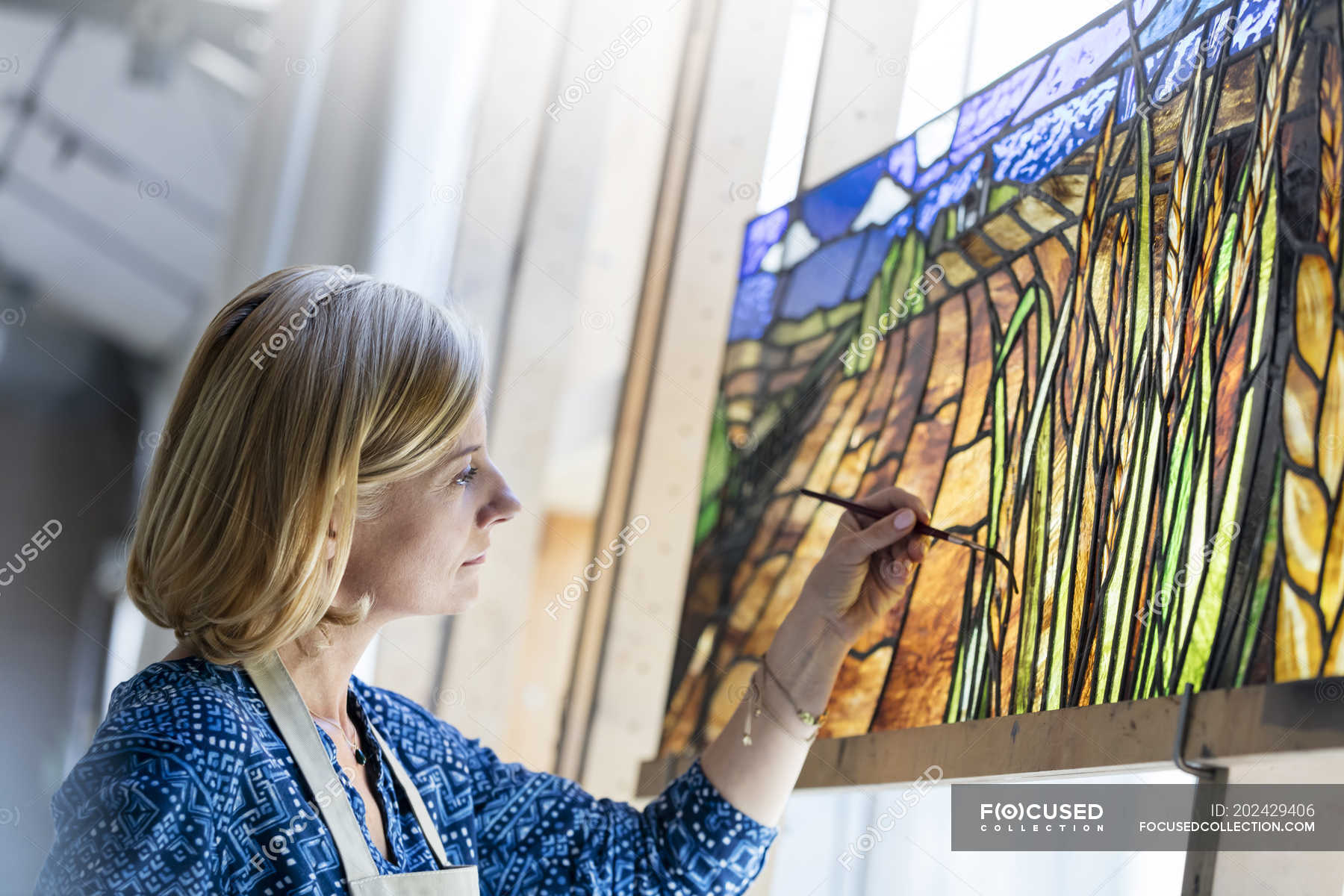 Stained glass artist finishing project — window, skill Stock Photo