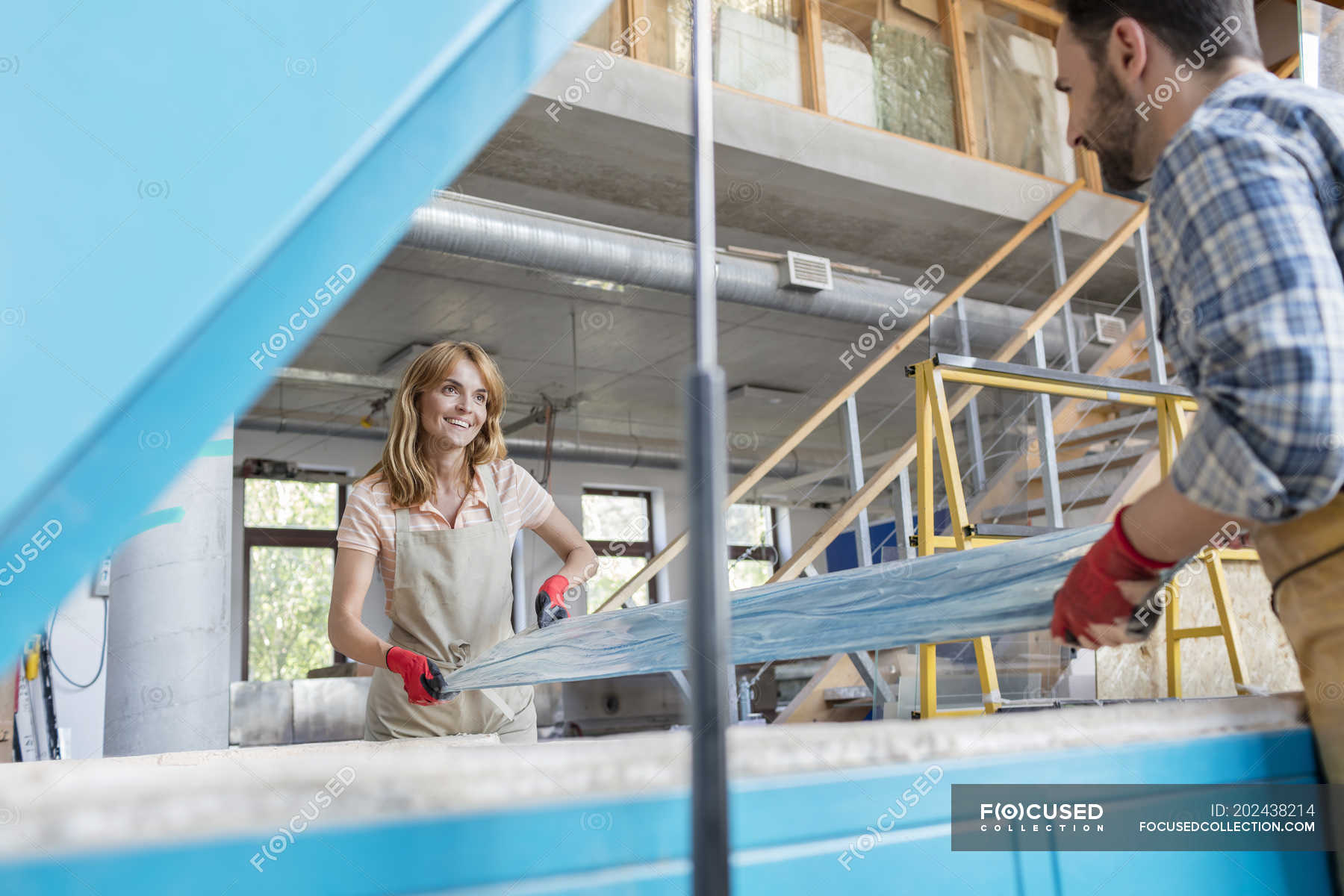 Artists placing stained glass in kiln in studio — teamwork, man Stock