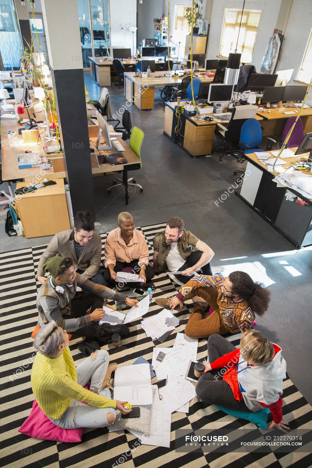 Creative business team meeting, brainstorming in circle on office floor —  High Angle View, vertical - Stock Photo | #212279314