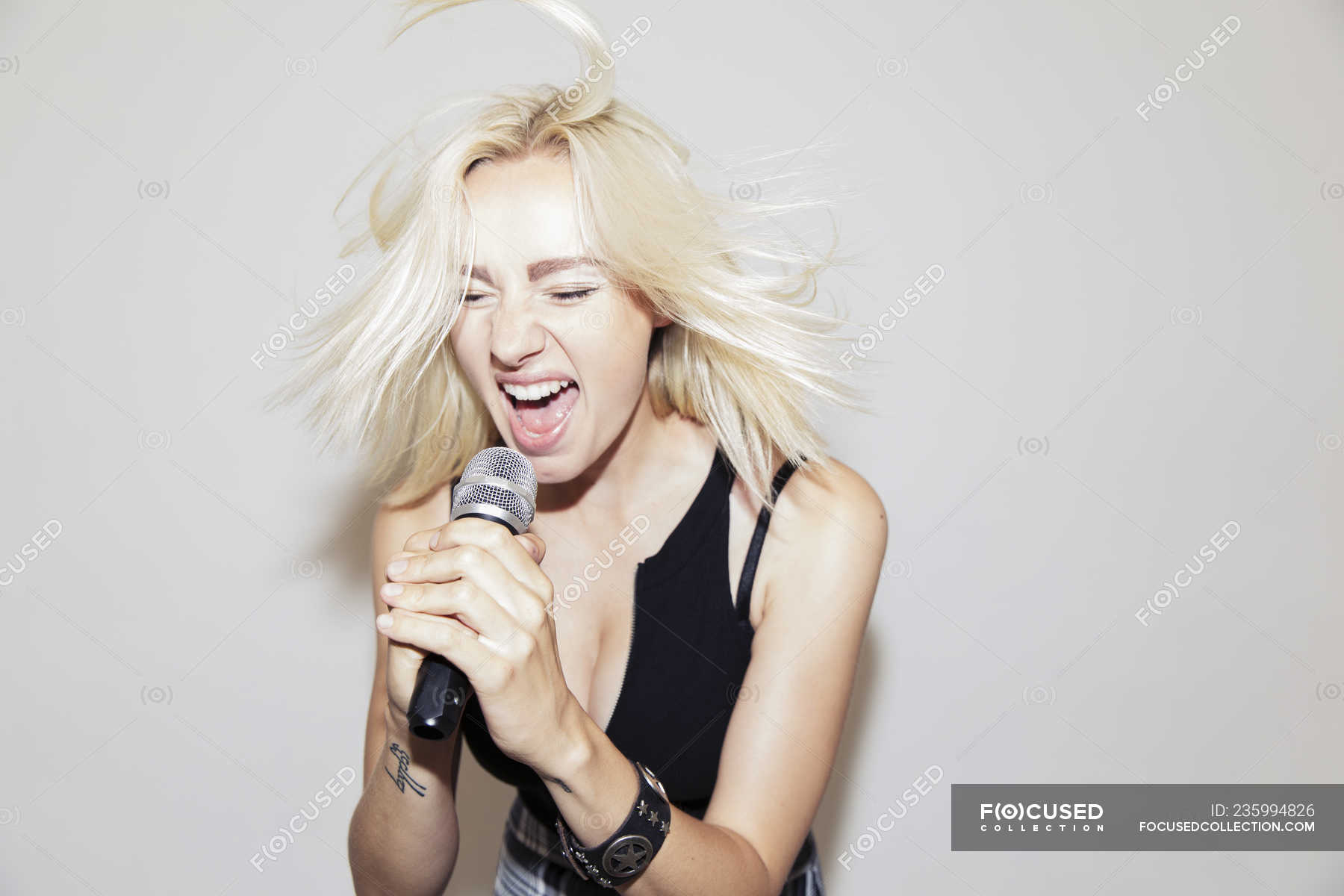someone singing into a microphone