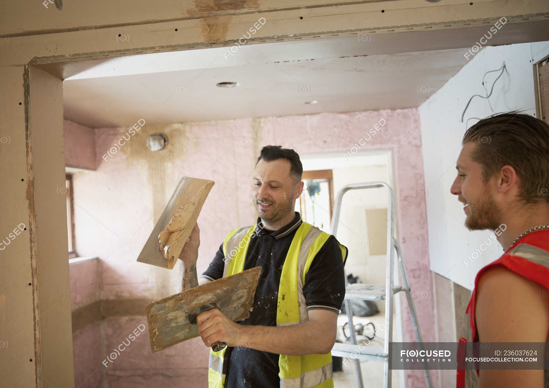 Construction Workers Plastering In House — Home Improvement, Indoors 