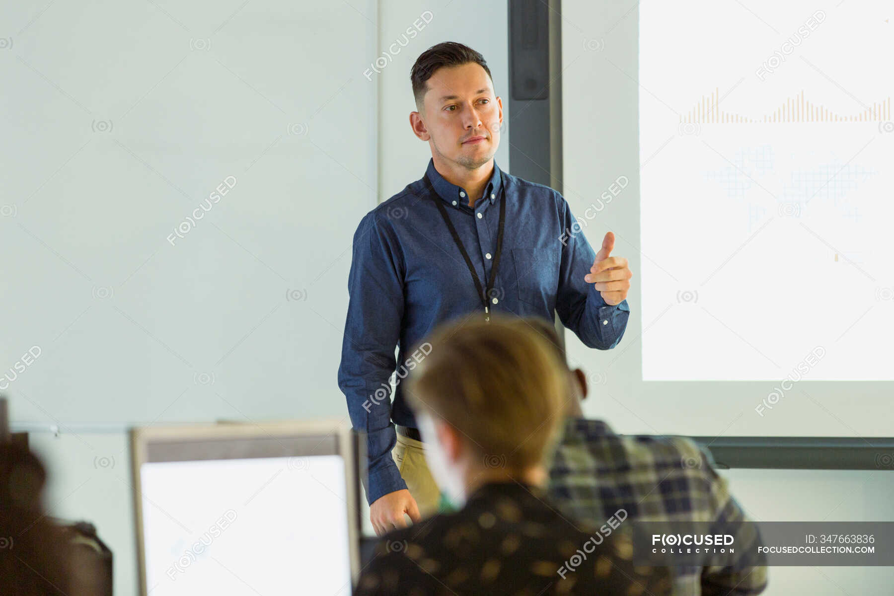 High school teacher talking, leading lesson in classroom — secondary ...