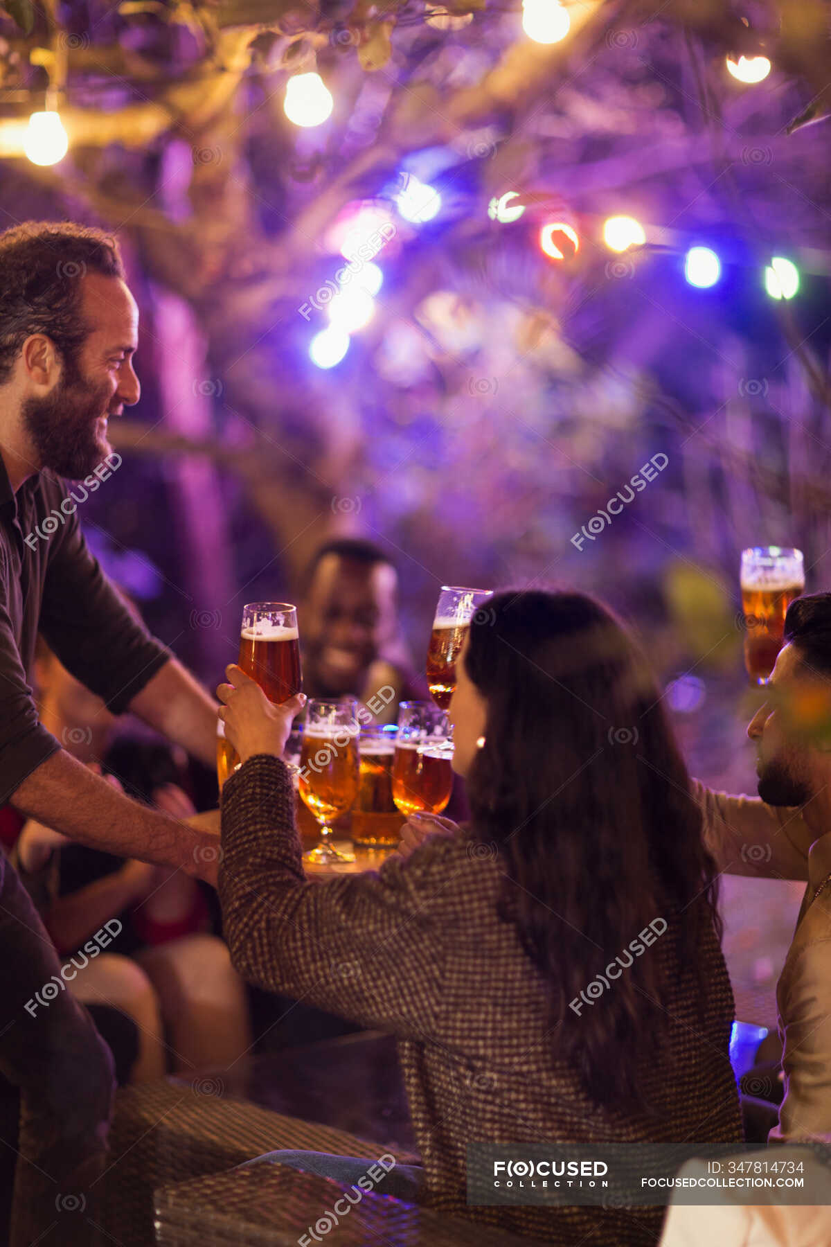 Friends drinking beer at garden party — women, party host - Stock Photo ...