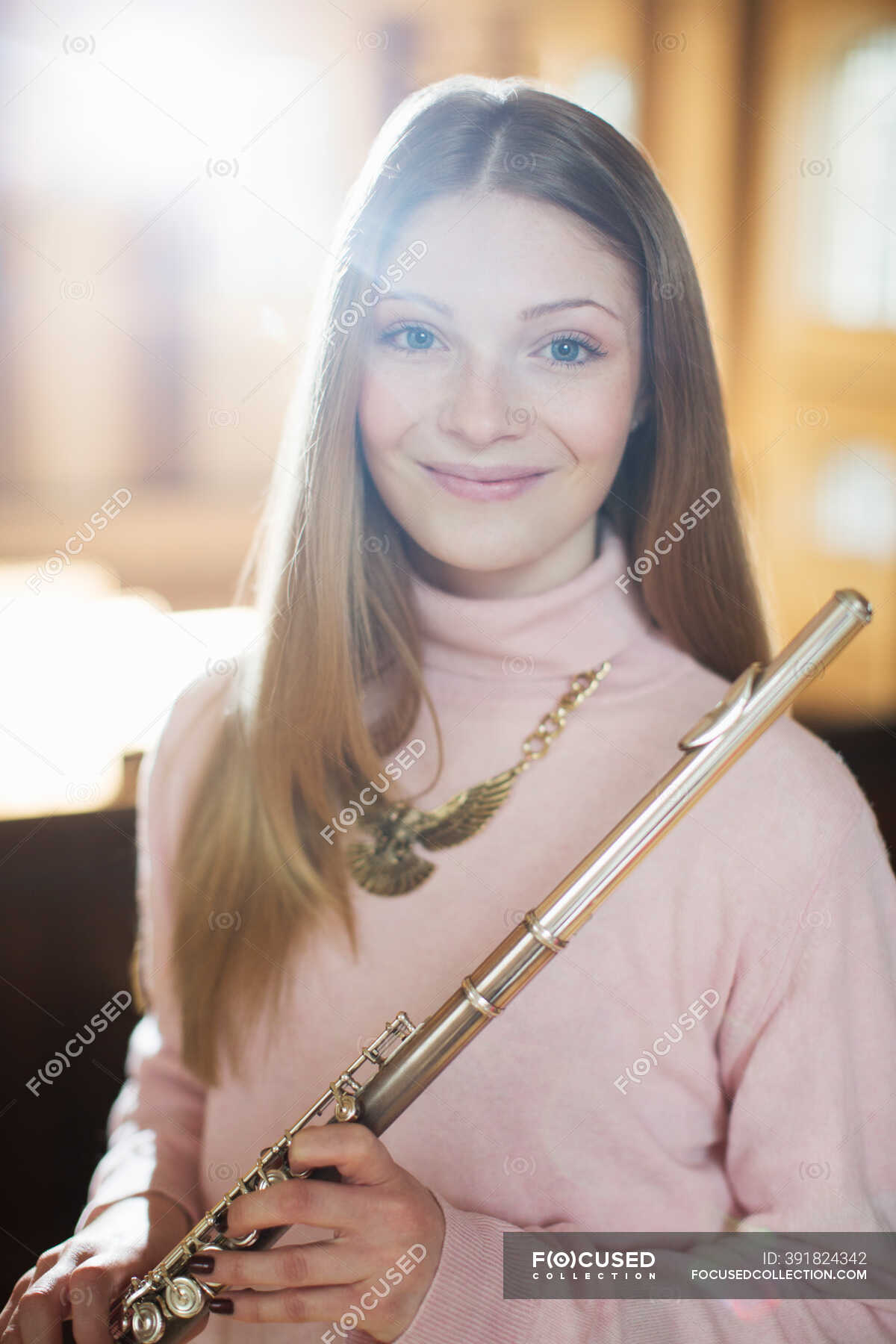 Portrait of smiling flutist — vertical, sunny Stock Photo 391824342