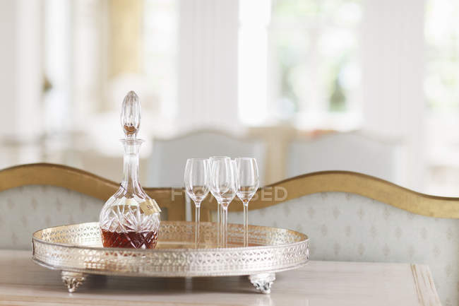 Crystal sherry decanter and cordial glasses on silver tray — Stock Photo