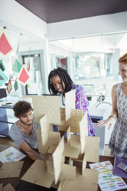 People building model in office — Stock Photo