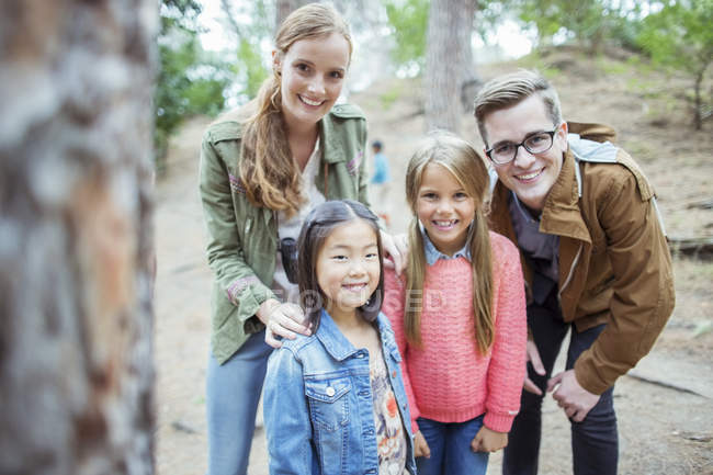 Students and teachers smiling in forest — Stock Photo