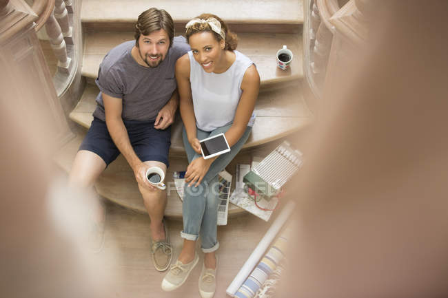 Couple sitting on stairs together — Stock Photo
