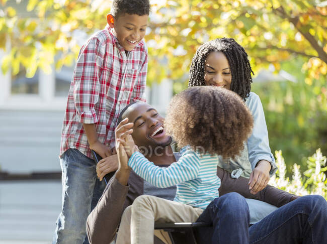 Happy family laughing outdoors — Stock Photo