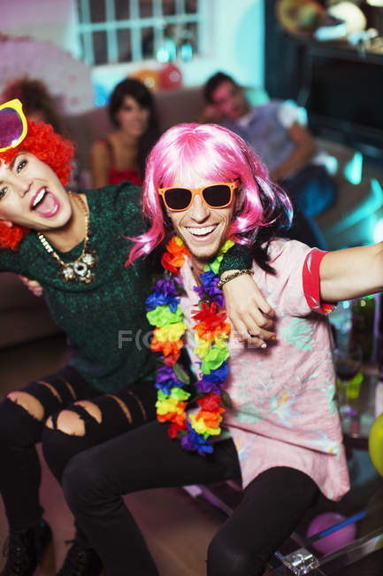 Couple wearing costumes at party — Stock Photo