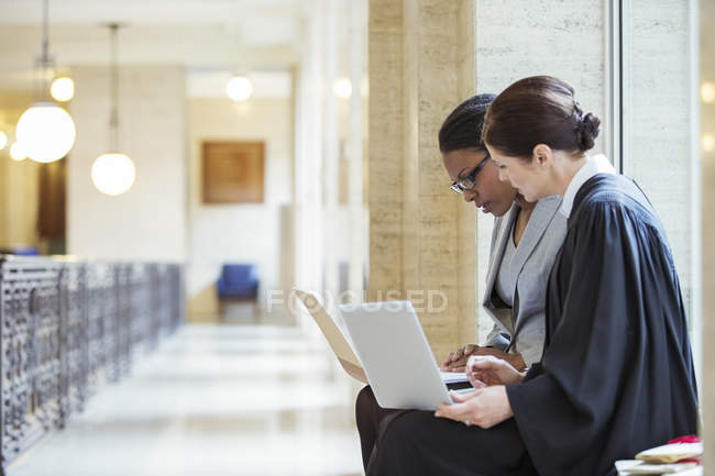 Judge and lawyer examining documents together — Stock Photo