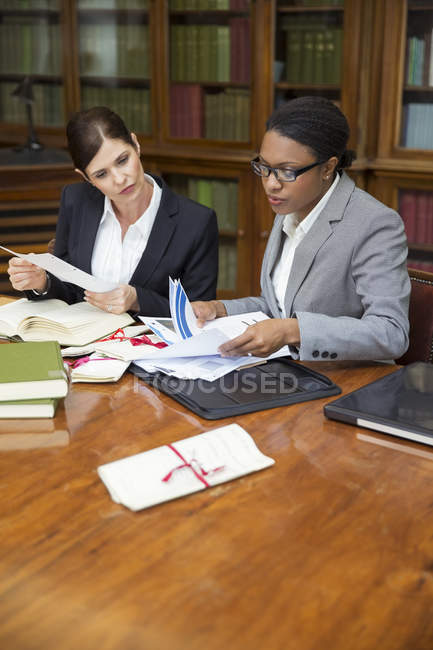 Lawyers doing research together in chambers — Stock Photo