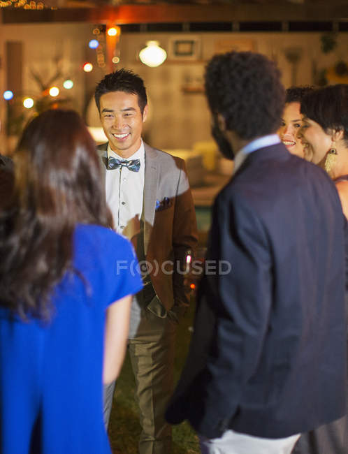 Friends talking at party — Stock Photo